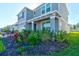 Two-story house exterior with gray siding and lush landscaping at 4009 Winding Meadows St, Apopka, FL 32712