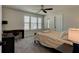 Cozy bedroom with a queen-size bed and a workspace at 4009 Winding Meadows St, Apopka, FL 32712