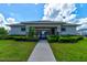 Community pool house with gated entrance and lush landscaping at 4009 Winding Meadows St, Apopka, FL 32712