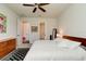 Bright bedroom with king-size bed and access to hallway and bathroom at 4009 Winding Meadows St, Apopka, FL 32712