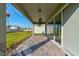 Relaxing backyard patio with paver stones, string lights, and seating area at 4009 Winding Meadows St, Apopka, FL 32712