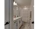 Clean bathroom with vanity, shower, and patterned curtain at 4009 Winding Meadows St, Apopka, FL 32712