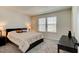 Comfortable bedroom with carpeted floor and large windows at 4009 Winding Meadows St, Apopka, FL 32712