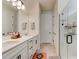 Elegant bathroom with double vanity, large mirror, and glass shower at 4009 Winding Meadows St, Apopka, FL 32712