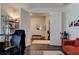 Home office with built-in desk and sitting area at 4009 Winding Meadows St, Apopka, FL 32712