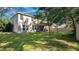 Home's backyard with covered patio and large yard at 521 Morgan Wood Dr, Deland, FL 32724