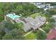 Community clubhouse with expansive lawn, surrounded by mature trees at 1400 Celebration Ave # 303, Celebration, FL 34747