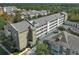 Aerial view of building exterior, highlighting unit location at 1400 Celebration Ave # 303, Celebration, FL 34747