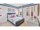 Nautical-themed bedroom with a twin-size bed and decorative oars at 33472 Copper Hill Way, Sorrento, FL 32776