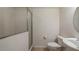 Simple bathroom with toilet, sink, and shower stall at 312 Nautica Mile Dr, Clermont, FL 34711