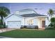 Two-story house, two-car garage, stone accents, landscaping at 1173 Basalt Ln, Sanford, FL 32771