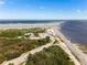 Aerial view of the beach, inlet and road with a parking area and park at 4260 S Atlantic Ave, Port Orange, FL 32127