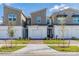 Modern 2 story townhome with 2 car garage and landscaped front yard at 1119 Boardwalk Pl, Kissimmee, FL 34747