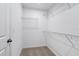 Spacious walk-in closet with wire shelving, providing ample storage space at 1119 Boardwalk Pl, Kissimmee, FL 34747