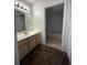 Clean bathroom with vanity, tub, and shower at 14013 Fairway Island Dr # 415, Orlando, FL 32837