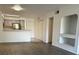 Living room with wood-look floors and built-in shelving at 14013 Fairway Island Dr # 415, Orlando, FL 32837