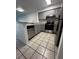 Modern kitchen with gray cabinets and stainless steel appliances at 14013 Fairway Island Dr # 415, Orlando, FL 32837