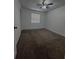 Well-lit bedroom featuring carpet and a ceiling fan at 14013 Fairway Island Dr # 415, Orlando, FL 32837