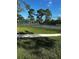 Well-maintained tennis court with grassy surroundings at 14013 Fairway Island Dr # 415, Orlando, FL 32837