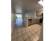 Open kitchen with gray cabinets, stainless steel appliances and view of living area at 14013 Fairway Island Dr # 415, Orlando, FL 32837