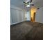 Bright bedroom with ceiling fan and access to bathroom at 14013 Fairway Island Dr # 415, Orlando, FL 32837