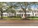 Two-story house with red front door, shutters, and landscaping at 9225 Northlake Pkwy, Orlando, FL 32827