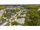 Aerial view of townhouses with lake and lush trees at 9225 Northlake Pkwy, Orlando, FL 32827