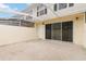 Screened-in patio with a concrete floor and sliding doors at 9225 Northlake Pkwy, Orlando, FL 32827