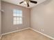 Simple bedroom with ceiling fan and neutral color scheme at 9225 Northlake Pkwy, Orlando, FL 32827