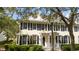 Two-story townhouse with black shutters and a lamp post at 9225 Northlake Pkwy, Orlando, FL 32827