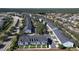 Aerial perspective of townhouses, highlighting their arrangement and proximity to roads at 643 Underwood Cv, Casselberry, FL 32707