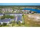 Aerial view of townhomes near a lake and other homes at 643 Underwood Cv, Casselberry, FL 32707