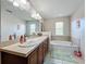 Bathroom with double vanity, soaking tub, and updated fixtures at 643 Underwood Cv, Casselberry, FL 32707