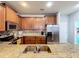 Well-equipped kitchen featuring granite counters and stainless steel appliances at 643 Underwood Cv, Casselberry, FL 32707