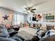 Bright and airy living room with sectional sofa and ample natural light at 643 Underwood Cv, Casselberry, FL 32707