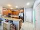 Modern kitchen with granite countertops and wood cabinetry at 643 Underwood Cv, Casselberry, FL 32707
