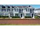 Two-story townhouses with gray siding, dark gray roofs, and landscaping at 643 Underwood Cv, Casselberry, FL 32707