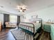 Spacious bedroom with large bed, sitting area, and ample natural light at 643 Underwood Cv, Casselberry, FL 32707
