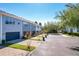 Exterior view of townhomes with attached garages and paved driveways at 643 Underwood Cv, Casselberry, FL 32707