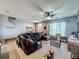 Gathering-friendly living room with sectional sofa and dining area at 643 Underwood Cv, Casselberry, FL 32707