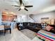 Open living room with a sectional sofa, kitchen, and dining area at 643 Underwood Cv, Casselberry, FL 32707