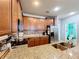 Kitchen with granite countertops and wood cabinets at 643 Underwood Cv, Casselberry, FL 32707