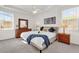 Main bedroom with a king-size bed and dresser at 416 Calabay Parc Blvd, Davenport, FL 33897