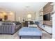 Living room with grey sofas and a large TV at 900 Las Fuentes Dr, Kissimmee, FL 34746