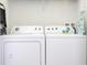 Convenient laundry room with washer and dryer at 900 Las Fuentes Dr, Kissimmee, FL 34746