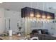 Modern chandelier above kitchen island at 900 Las Fuentes Dr, Kissimmee, FL 34746