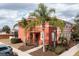 Two-story home with palm trees and landscaping at 900 Las Fuentes Dr, Kissimmee, FL 34746