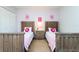 Cozy twin bedroom with two beds, a nightstand, and pink accents at 900 Las Fuentes Dr, Kissimmee, FL 34746