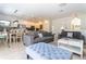 Open living room with comfortable seating and view into kitchen at 900 Las Fuentes Dr, Kissimmee, FL 34746