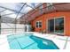 Screened-in pool with patio furniture at 900 Las Fuentes Dr, Kissimmee, FL 34746